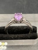 A 9ct white gold Kunzite style ring with diamond shoulders.Size L