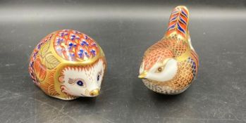 Two boxed Royal Crown Derby paperweights, Hedgehog and Wren, one gold stopper and one silver