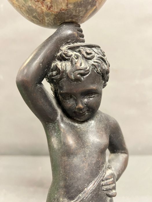 A bronze and marble statue of a boy holding a marble ball above his head - Image 3 of 7
