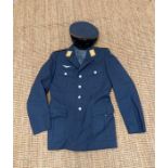 A German air force officers parade jacket with insignia and accompanying cap