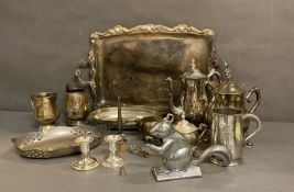 A collection of white metal items to include candlesticks, coffee pots and a squirrel nut cracker
