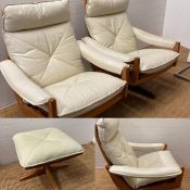 A pair of Norwegian Lied Mobler teak and white leather revolving and reclining chairs