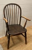 A spindle backed farmhouse arm chair