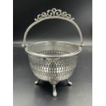 A Victorian hallmarked silver pierced basket on four feet with handle. Birmingham 1857 by Henry