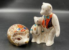 Two boxed Royal Crown Derby paperweights, Hedgehog and two teddy bears, one with gold stopper