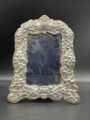 A Britannia silver easel backed picture frame with floral decoration, hallmarked Birmingham 1990