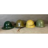 A selection of four military helmets