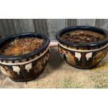 A pair of glazed garden pots