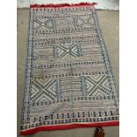 A hand woven Moroccan Berber rug 240cm x 142cm