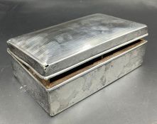 A hallmarked silver cigarette box AF Birmingham 1927.