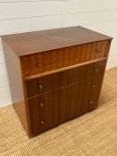 A Uniflex Mid Century chest of drawers with inlaid top drawer by Peter Haywood (H76cm W78cm D45cm)