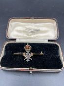 A Queen Victoria Royal presentation brooch with crown and initials.