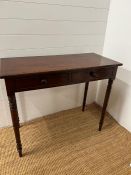 A mahogany hall table with twin drawers to centre and turned legs (H80cm W100cm D46cm)
