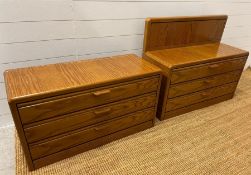 A pair of wide bedsides with three drawers, made in Germany (H48cm W91cm D36cm)