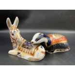 Two boxed Royal Crown Derby paperweights, Moonlight Badger and Donkey, both with gold stopper