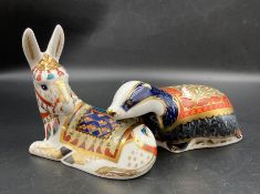 Two boxed Royal Crown Derby paperweights, Moonlight Badger and Donkey, both with gold stopper