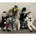 A collection of clowns and Pierrot clown with porcelain faces