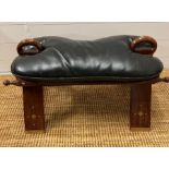 A camel seat with a leather seat pad and inlay brass decorations (H38cm W70cm)