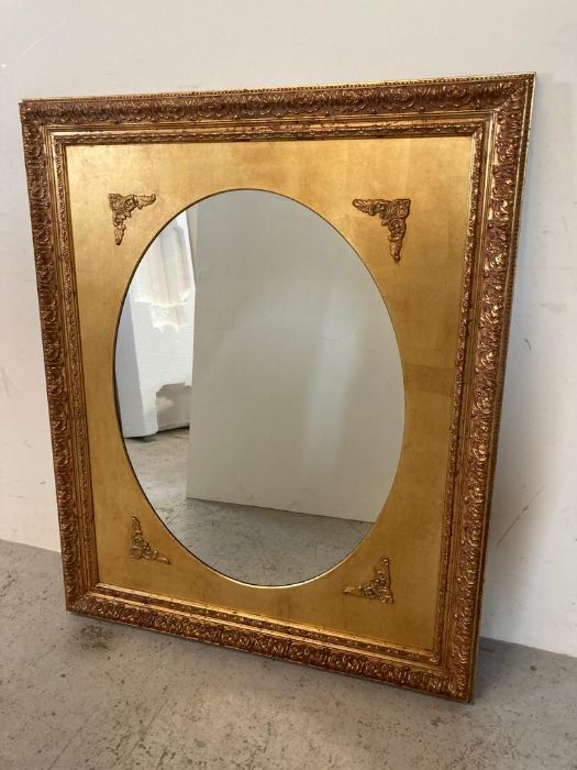 A wooden framed gold painted hall mirror 98cm x 119cm