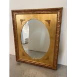 A wooden framed gold painted hall mirror 98cm x 119cm