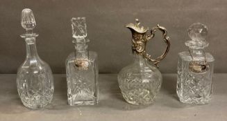 A selection of four cut glass decanters one with silver decanter tag hallmarked for birmingham