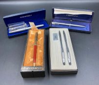 A selection of fountain pens, roller ball and propelling pencils to include Cross Papermate and