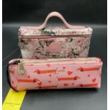 Two ladies wash bags a Longchamps with floral design and one by Fenella Smith with dachshunds