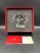 A Baccarat crystal horse head ornament, boxed.