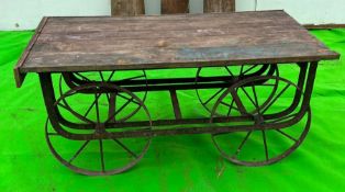 A vintage reclaimed cart, wooden planked top on metal frame and spindle wheels (H58cm Q127cm D69cm)