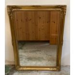 A pair of wooden gold painted hall mirrors