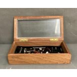 A portable display case containg a collection of antique stamps