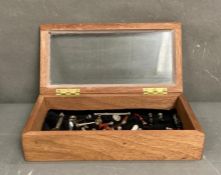 A portable display case containg a collection of antique stamps