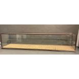 Display case and with dimensions of: L: 128 cms x H: 28 cms x D: 31 cms.