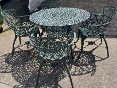A metal garden table with four chairs with scrolling design (H68cm Dia100cm)
