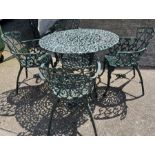 A metal garden table with four chairs with scrolling design (H68cm Dia100cm)