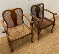 A pair of cane arm chairs with walnut frame (One AF)