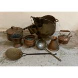 A selection of copper and brass items to include a coal scuttle, teapot and a chestnut roaster