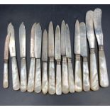 A Harlequin set of silver knives with mother of pearl handles, various makers and hallmarks