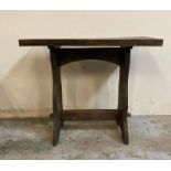 A vintage hall table with cross stretcher on splayed feet