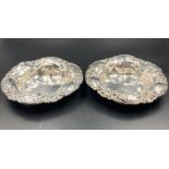 A pair of sterling silver bowls, approximate total weight 125g, both with floriate design.