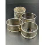 A selection of four silver napkin rings with various hallmarks and makers. Approximate Total