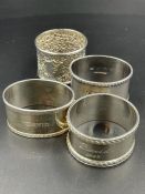 A selection of four silver napkin rings with various hallmarks and makers. Approximate Total