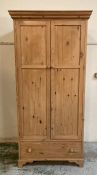 A two door pine wardrobe with drawer under (H200cm W95cm D66cm)