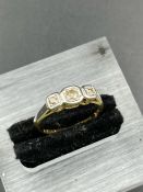 An 18ct yellow gold three diamond on a platinum mount ring (Approximate Total Weight 2.2g)