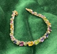 A Harlequin stone bracelet marked 10K, approximate total weight 9.1g,