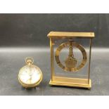 Two clocks, A Roskoff and Co glass spherical desk clock and a carriage clock by Kaiser