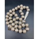 A large set of Arabian silver worry beads approximately 1400g