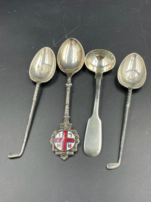 A selection of four silver hallmarked spoons, various themes and hallmarks (Approximate Total weight