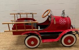 An F.A.O Schwartz or New York child's pedal fire engine