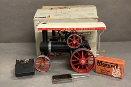 A boxed Mamod steam tractor